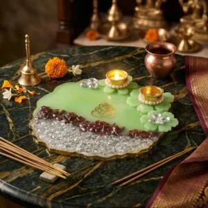 resin ganesh puja platter with diya and decorative green design for festive pooja